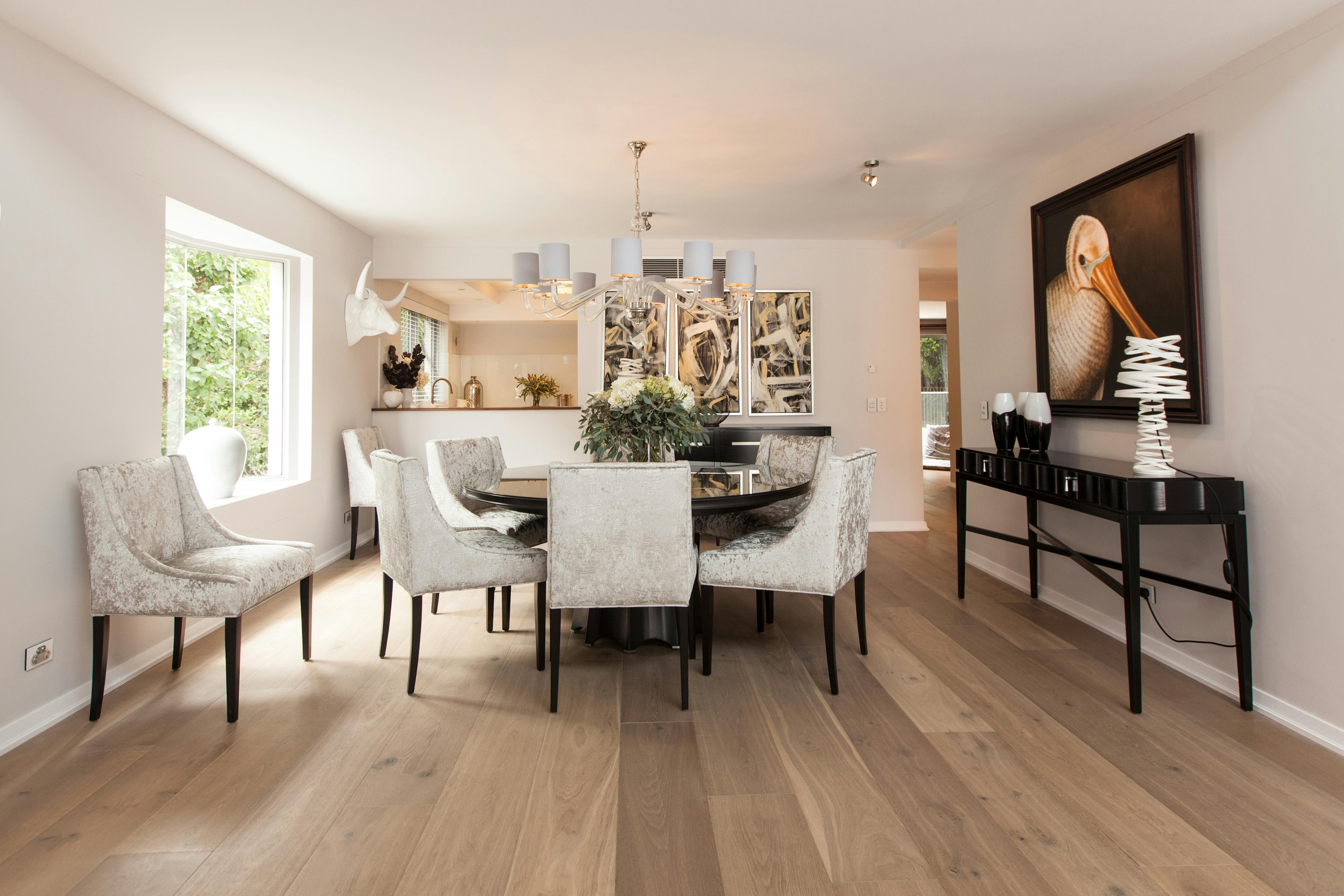 Wide plank natural color engineered hardwood in dining room
